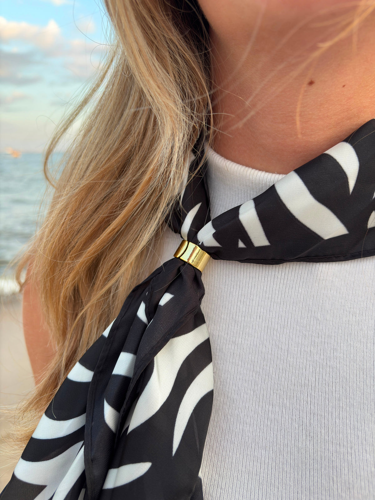 Nuit Scarf worn as neckerchief at the beach